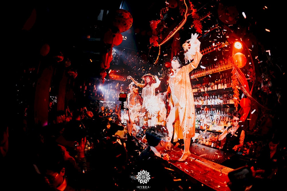 The bar area doubles as a stage for dancers and artists, creating a truly unique experience